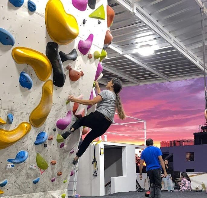 bouldering gym and girl climber female routesetting before Salkantay trekking after Rock climbing tour to Macchu Picchu with Alejandro Cornejo operate by sky viajes and Peru climb