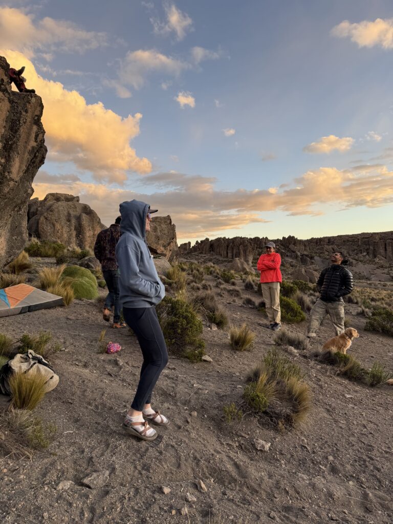 girl bouldering during group climbing tour offered by Climbing rooftop and PeruClimb in Colca Canyon Coporaque Peru