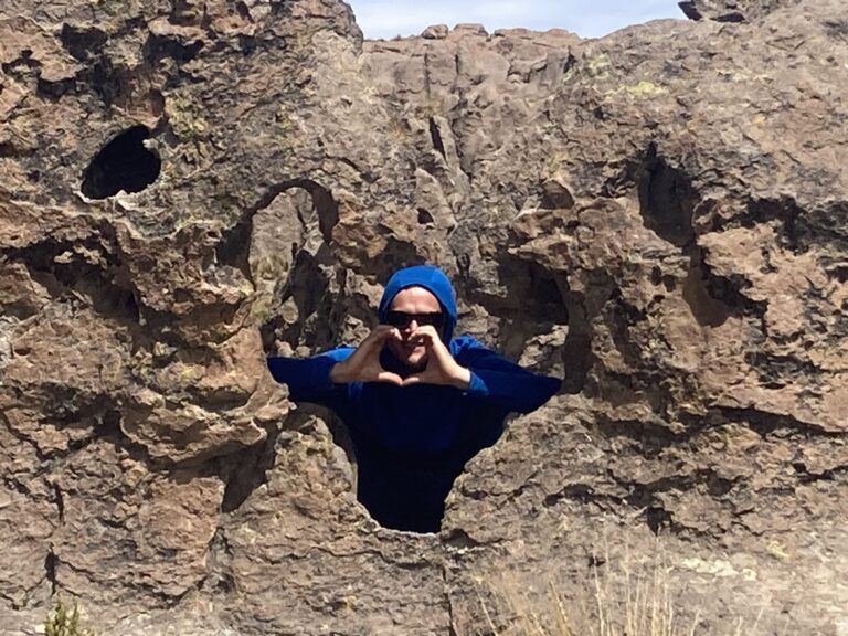 girl bouldering during group climbing tour offered by Climbing rooftop and PeruClimb in Colca Canyon Coporaque Peru
