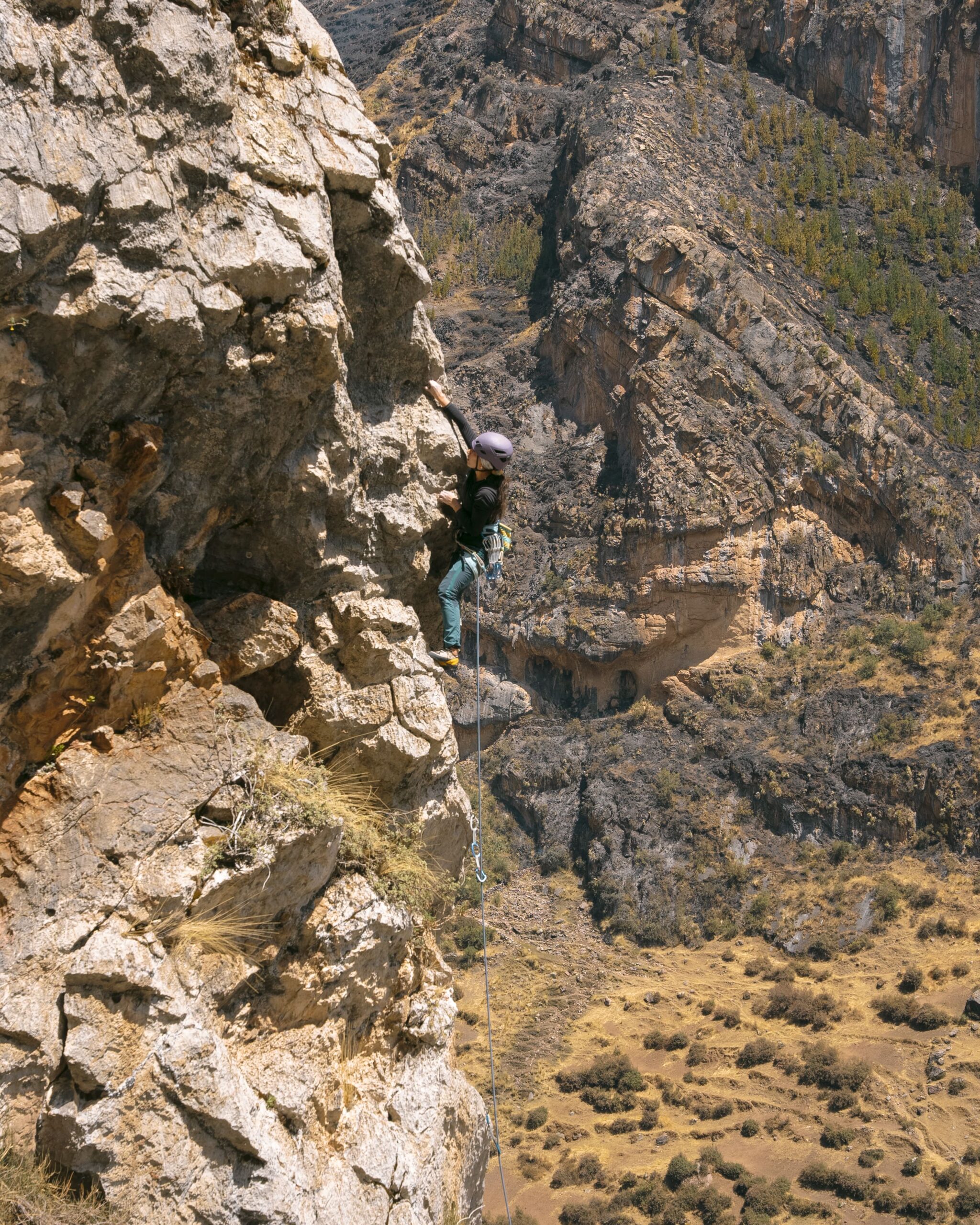 climber girl during rock climbing tour with Alejandro Cornejo and Climbing Rooftop in Pitumarca Cusco Peru