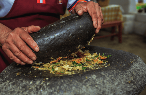 female chef in local restaurante picanteria Arequipa Peru with sky viajes y turismo