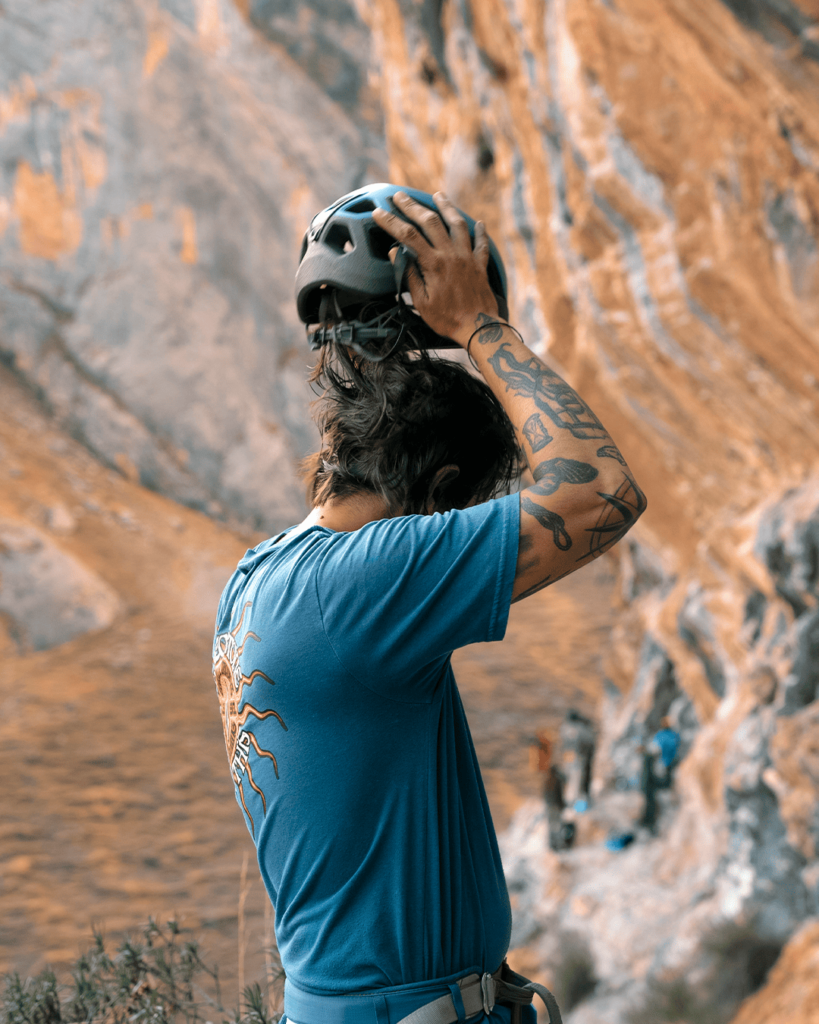 climber guide with rock climbing helmet and equipment Chilina Valley Arequipa Peru with Climbing Rooftop boulder gym and rapel