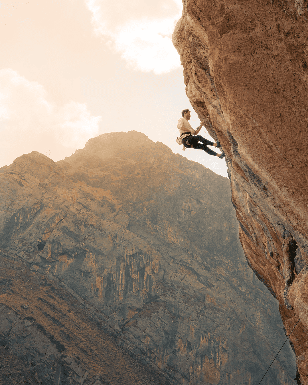 rock climber during rock climbing tour with Alejandro Cornejo and Climbing Rooftop in Pitumarca Cusco Peru