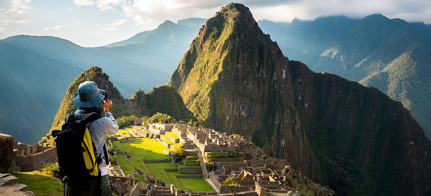 female travelers in Machu picchu during Salkantay trekking after Rock climbing tour to Macchu Picchu with Alejandro Cornejo operate by sky viajes and Peru climb