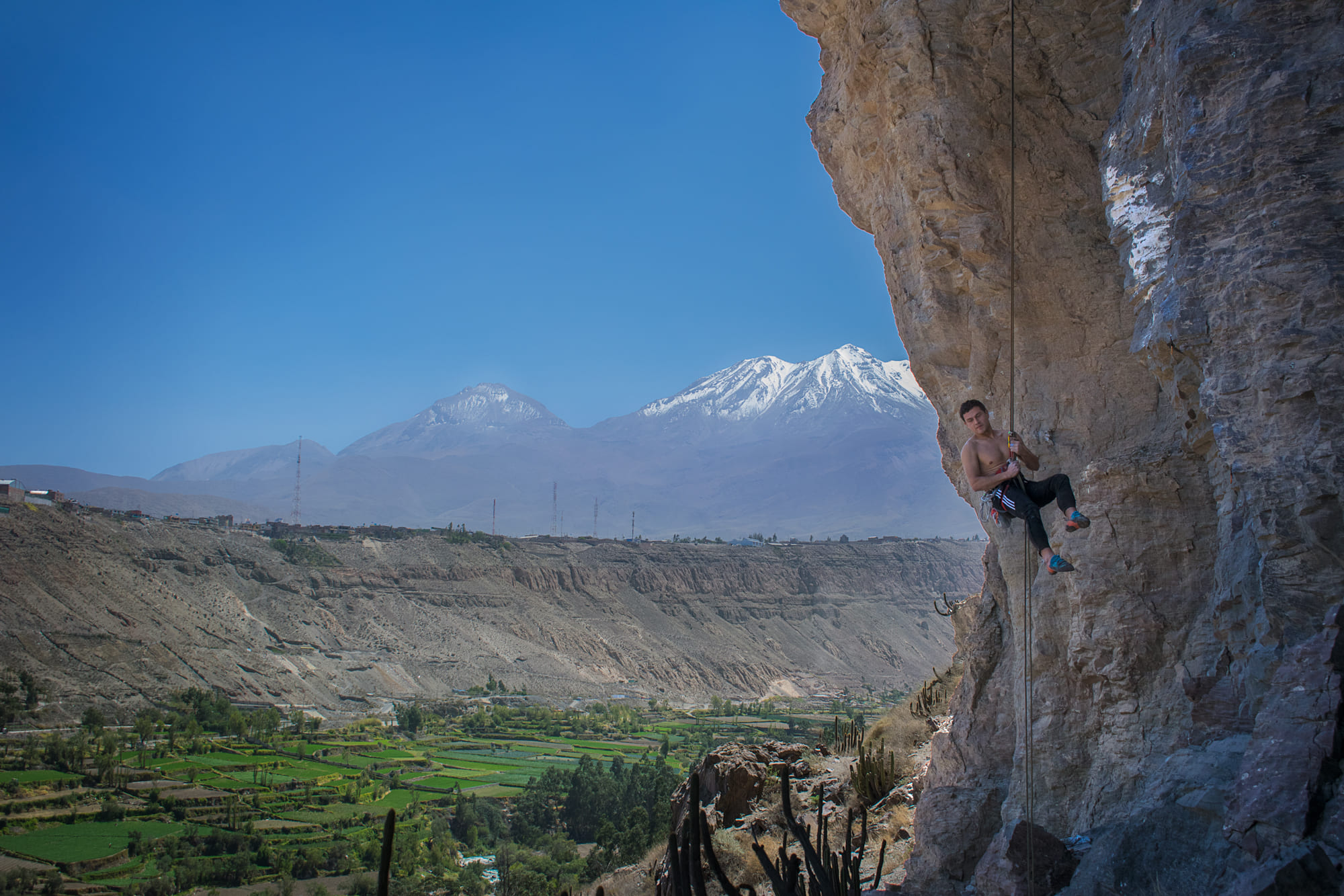 girl rock climbing Chilina Valley Arequipa Peru with Climbing Rooftop boulder gym and rapel